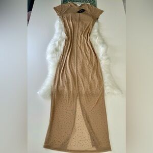 Maxi dress, large, transparent, with rhinestone details, opening at the bottom